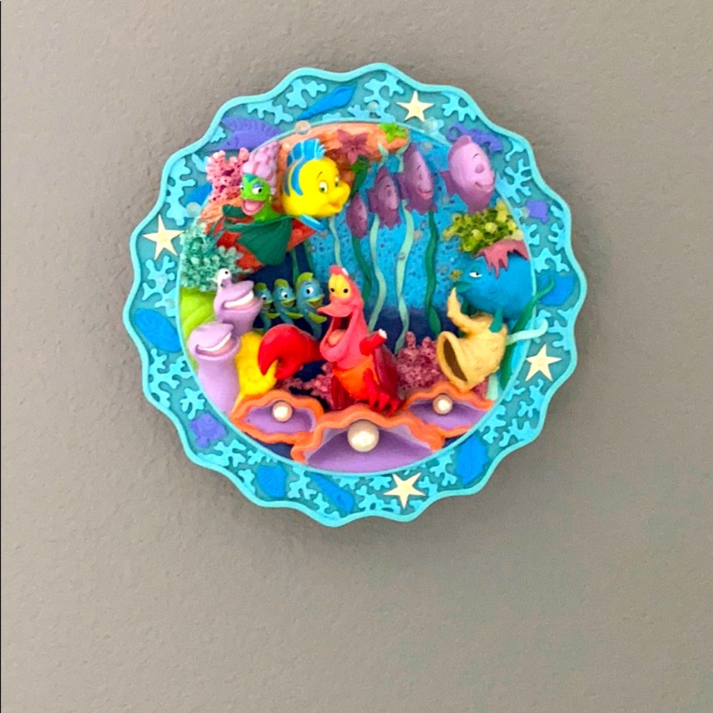 The little mermaid plate hangs on the wall